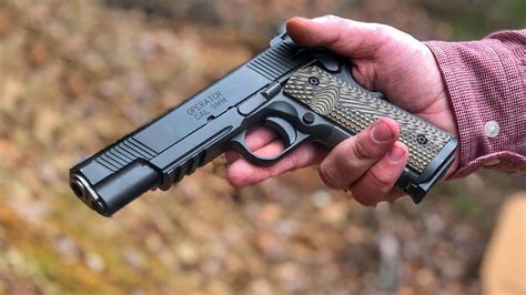 A civilian shooter holding a 1911 handgun