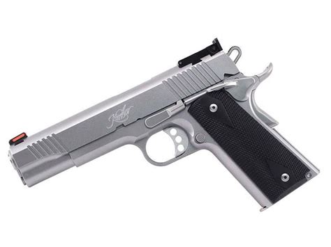 A 1911 pistol with aftermarket accessories and upgrades