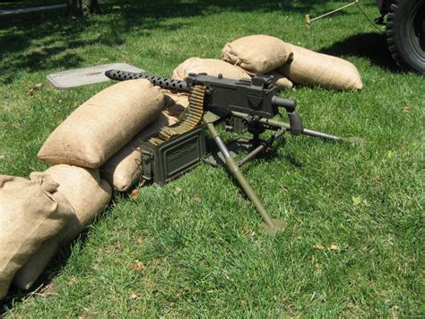 A US soldier firing the 30 cal machine gun during World War II