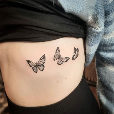 3D butterfly tattoo on ribcage