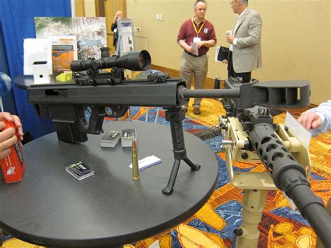 Military Personnel Firing an M2 Machine Gun