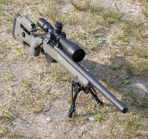 A rifle chambered in 6.5 Creedmoor with a high-quality scope