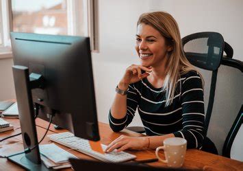 Administrative Specialist working on a computer