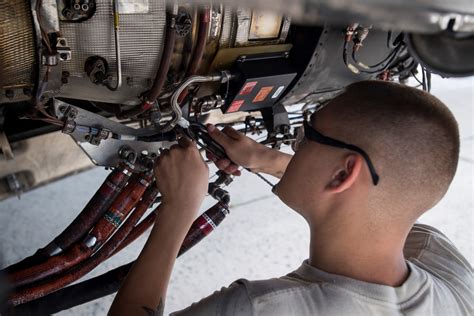 Air Force Aircraft Mechanic Repairing Aircraft Engine