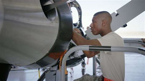 Air Force Aviation Mechanic Working on Aircraft