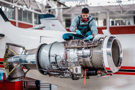 Air Force Plane Mechanic Working on Aircraft