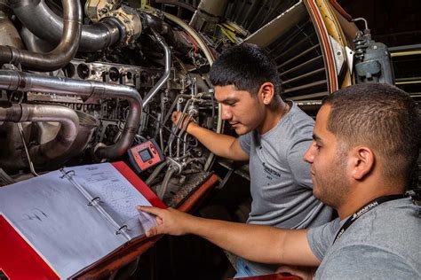 Aircraft Engine Mechanic working on a jet engine