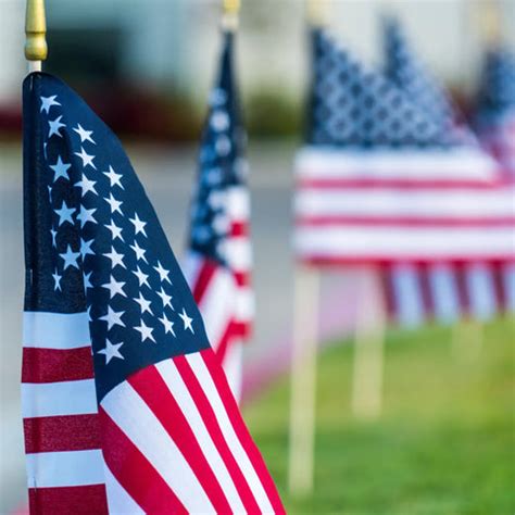 A photo of the American flag being displayed at a traditional event