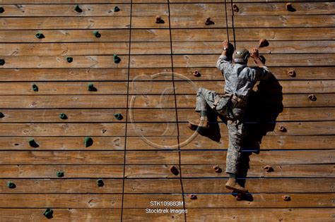 Army Rangers climbing a wall