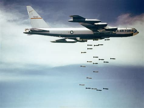 B-52s dropping high-yield bombs on enemy targets