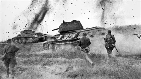 A Soviet T-34 tank moves through a field during the Battle of Kursk