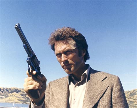 Clint Eastwood holding his 44 Magnum in a memorable pose