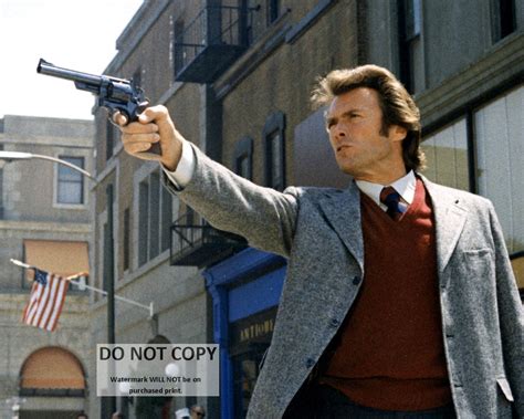 Clint Eastwood holding his 44 Magnum