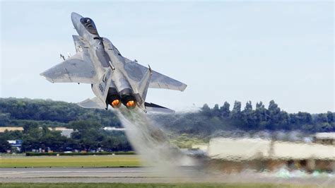 An F-15 fighter jet taking off