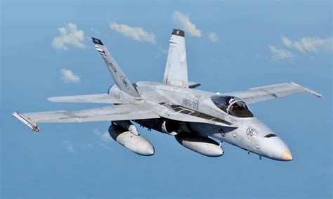 F/A-18 Hornet in flight over the ocean