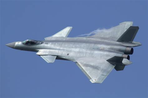 F-22 Raptor and J-20 in flight