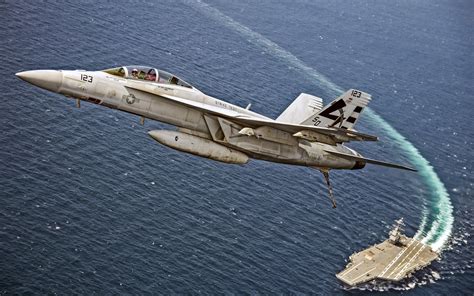 Boeing F/A-18E/F Super Hornet taking off from an aircraft carrier