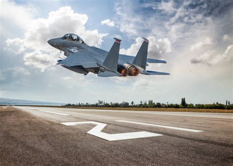 Fighter jet taking off from a runway