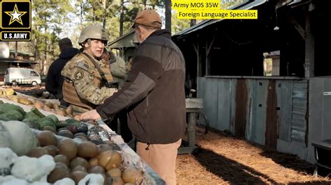 US Army Foreign Language Specialist trainees practice language skills during a training exercise