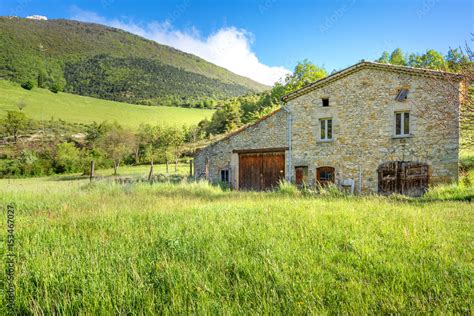 The rolling hills of the French countryside, with a picturesque village in the distance