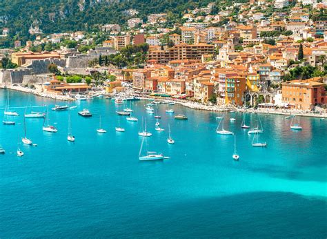 The sparkling Mediterranean Sea, with a picturesque coastal town in the background