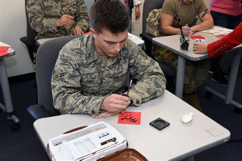 US Army linguist interprets for a commander during a meeting with local officials in Afghanistan