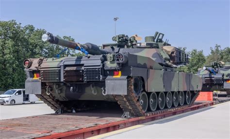 M1A2 Abrams tank being transported by a heavy-lift helicopter