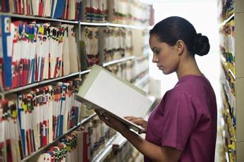 Medical Records Technician Working on Computer