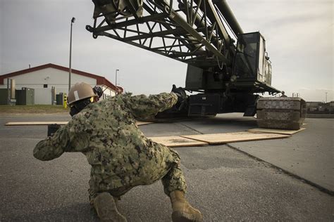 Navy Equipment Operator working on a crane