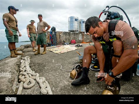 Navy Equipment Operator working with team