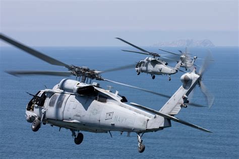 Helicopter taking off from a naval ship