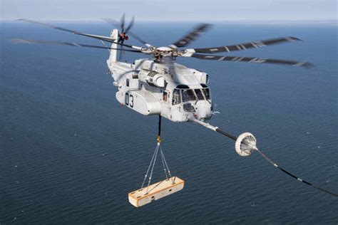 Helicopter taking off from a naval ship