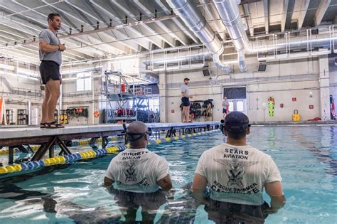 Navy Aviation Rescue Swimmers with Helicopter Rescue Basket