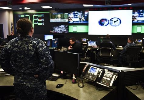 Navy Cybersecurity Officer Working on Computer