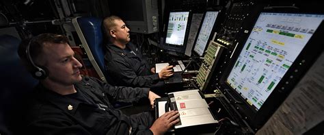 Navy engineer working on a computer