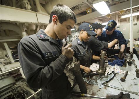 Navy engineer working with a team