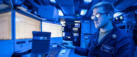 Navy Operations Specialists analyzing intelligence