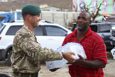 Navy MPs and Marines providing humanitarian aid