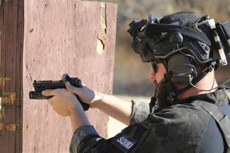 Navy SEALs training with pistols