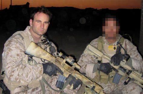 Navy SEAL with an MK 12 SPR rifle