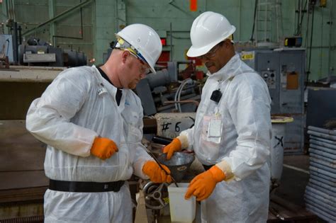 Nuclear Engineer Collaborating with Experts in a Meeting