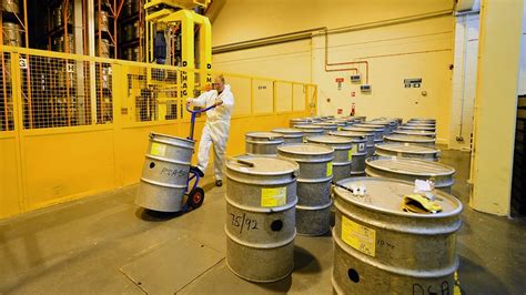 Nuclear Engineer Managing Waste in a Storage Facility