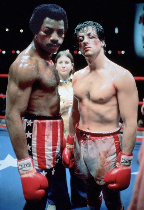 Rocky Balboa and Apollo Creed facing off in the ring