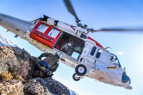 Helicopter rescuing a sailor from the water