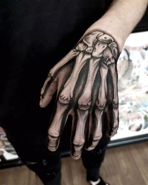 Skull Hand Tattoos