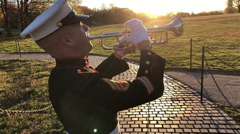 A bugler playing Taps at a memorial service