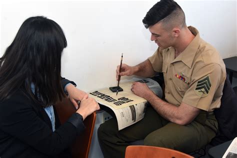 US Army linguist trainees practice language skills during a training exercise