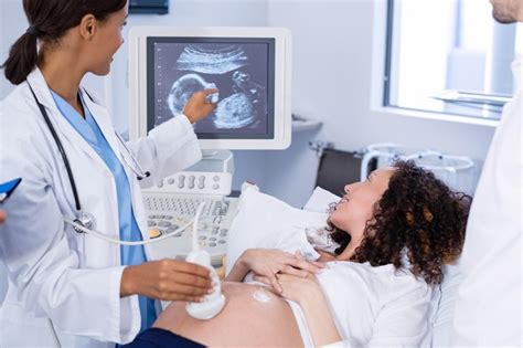 Ultrasound Technician Collaborating with Doctors