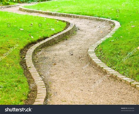 A winding path through a dense forest