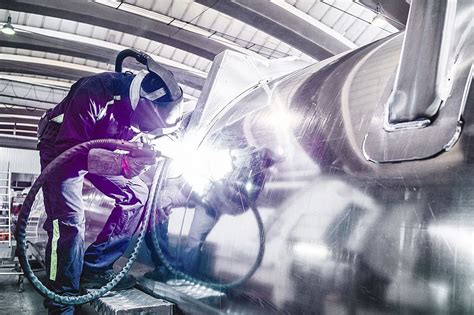 Welder working on an aircraft